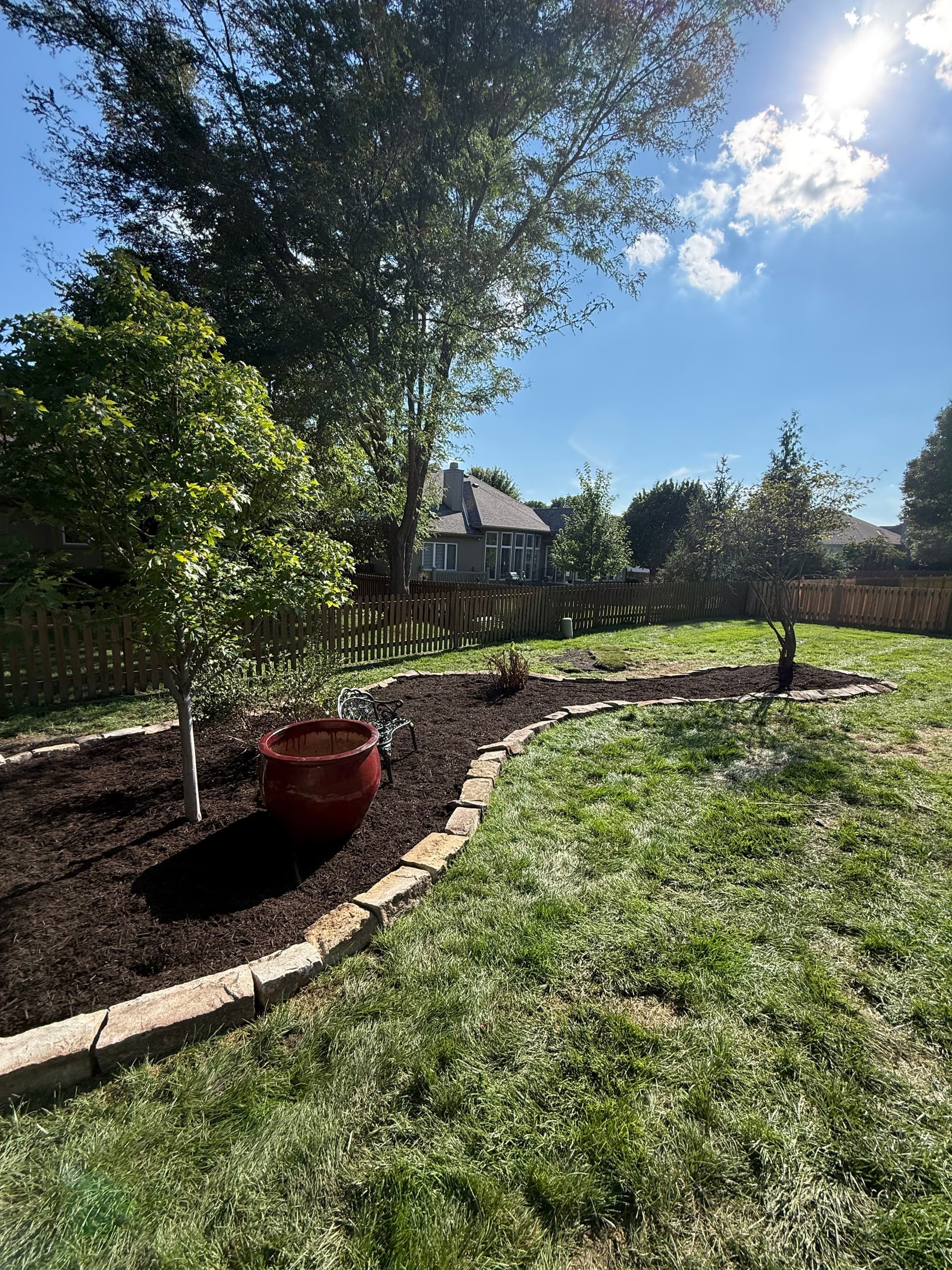Garden Beds Built From Scratch With Stone Edging and Fresh Mulch
