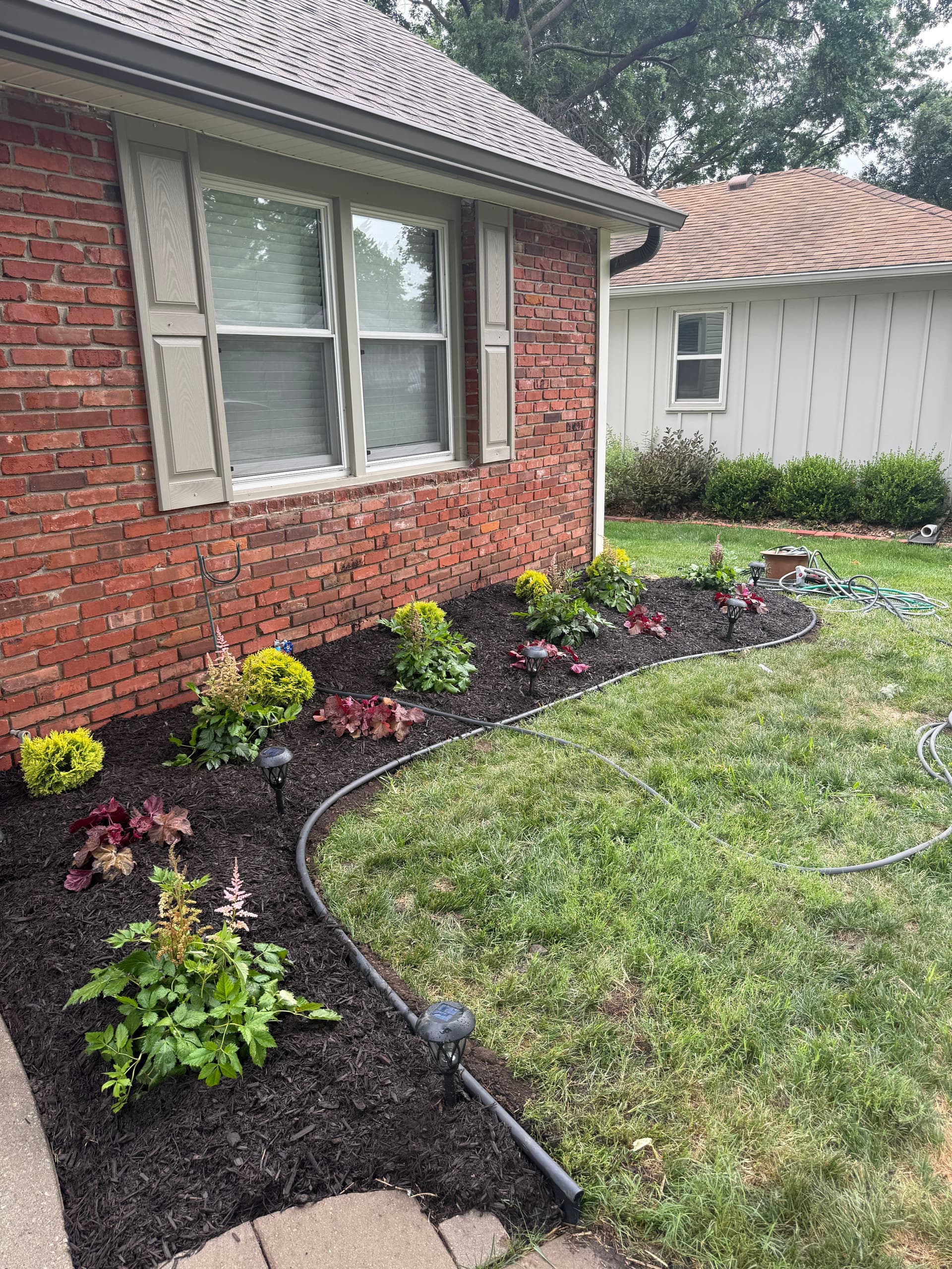 Shawnee Front Yard Garden Bed Makeover with Fresh Mulch and New Plants image