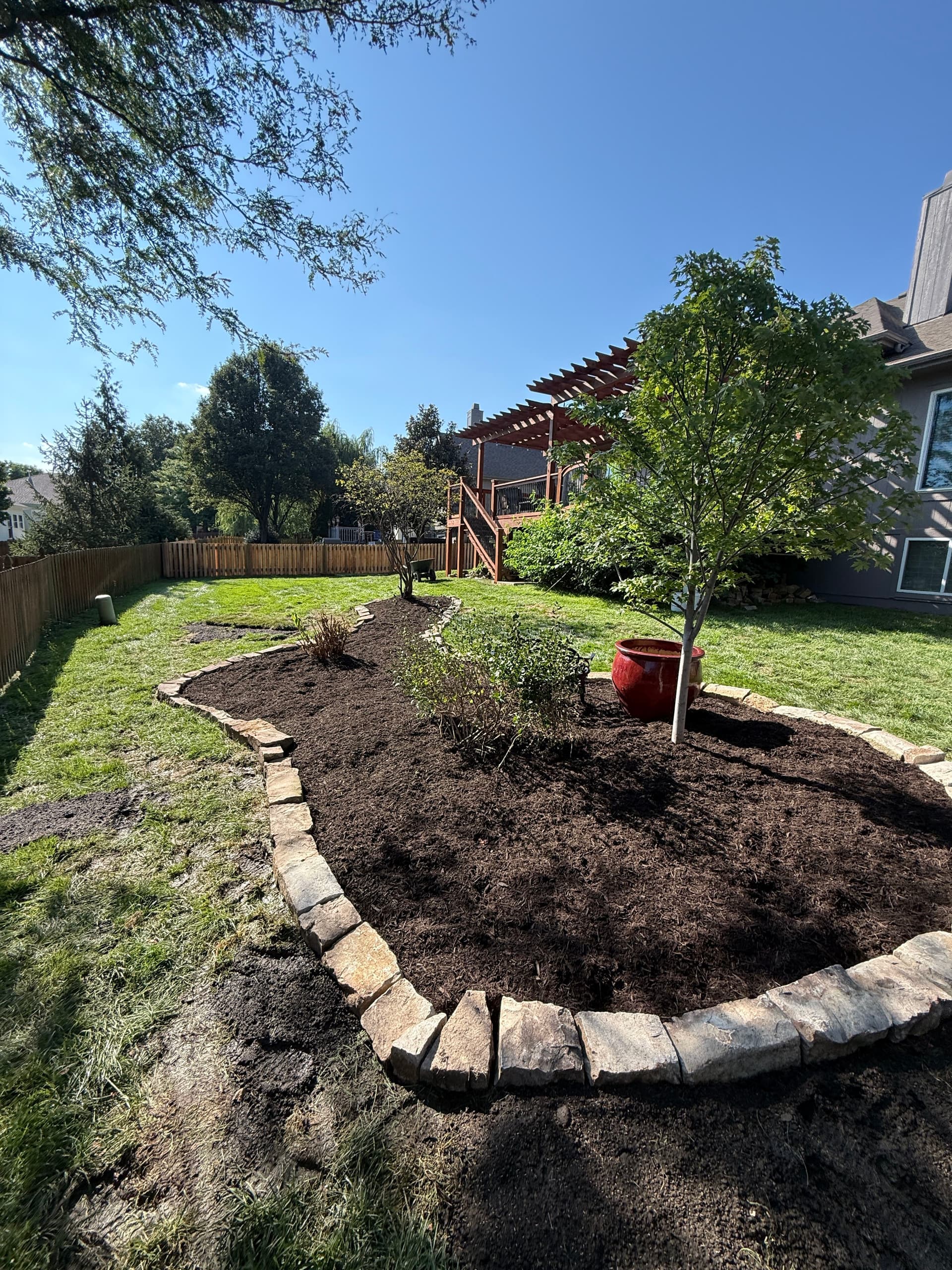 Gallery photos for Garden Beds Built From Scratch With Stone Edging and Fresh Mulch: Image #1