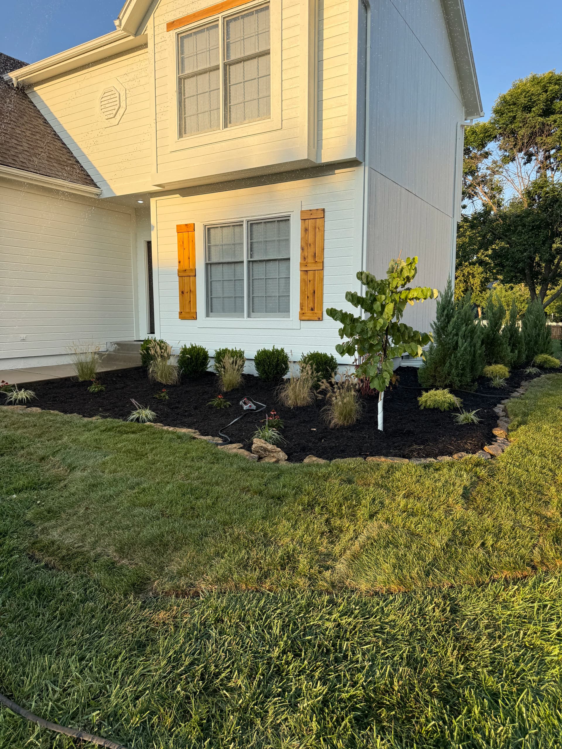 Gallery photos for Fresh Planting Beds and Mulch Boost Curb Appeal in Olathe: Image #1