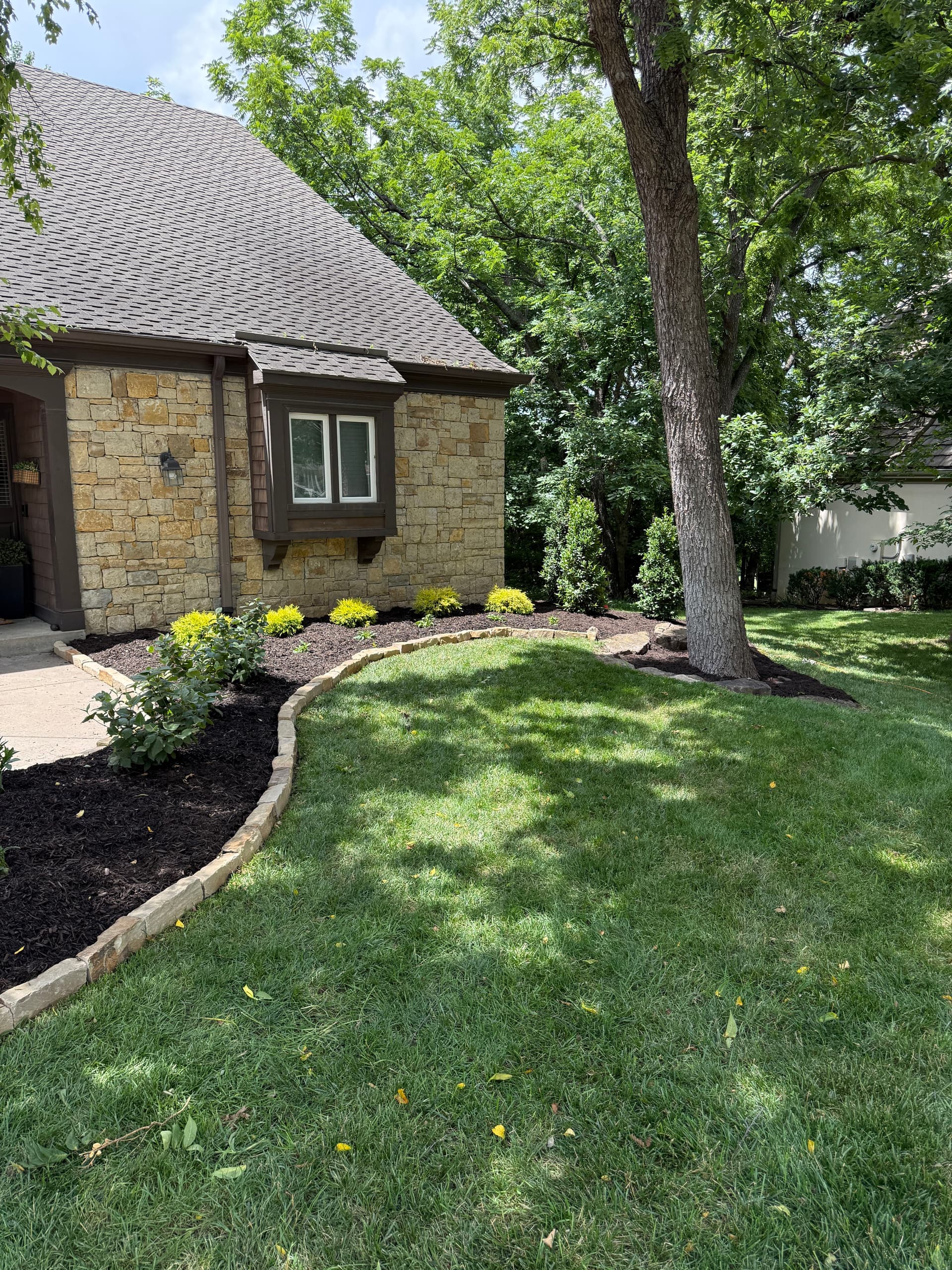 Gallery photos for Stone Edging, Shrubs, and Mulch Give This Lenexa Home a Clean Reset: Image #1